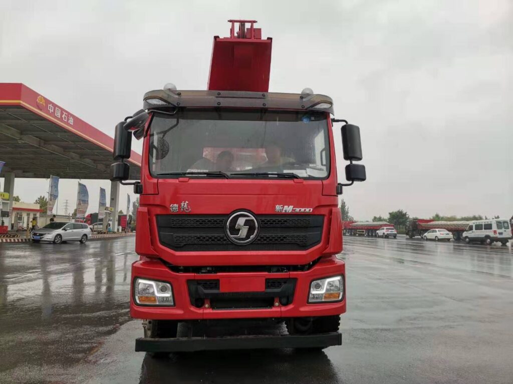 VANCE oilfield production truck LGC5220TCY artificial lift drive unit connected to wellhead pumping unit during active oil production operation