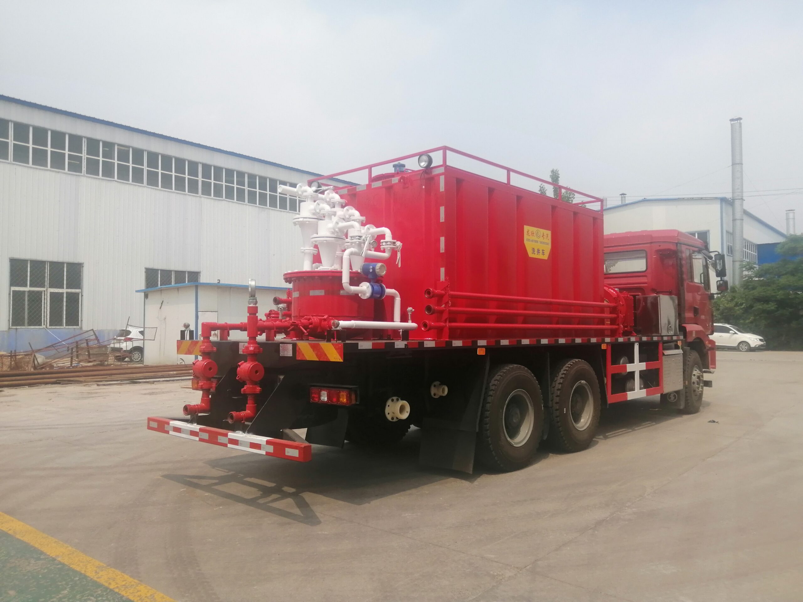 Sand flushing unit rear right angle — discharge manifold and tank system