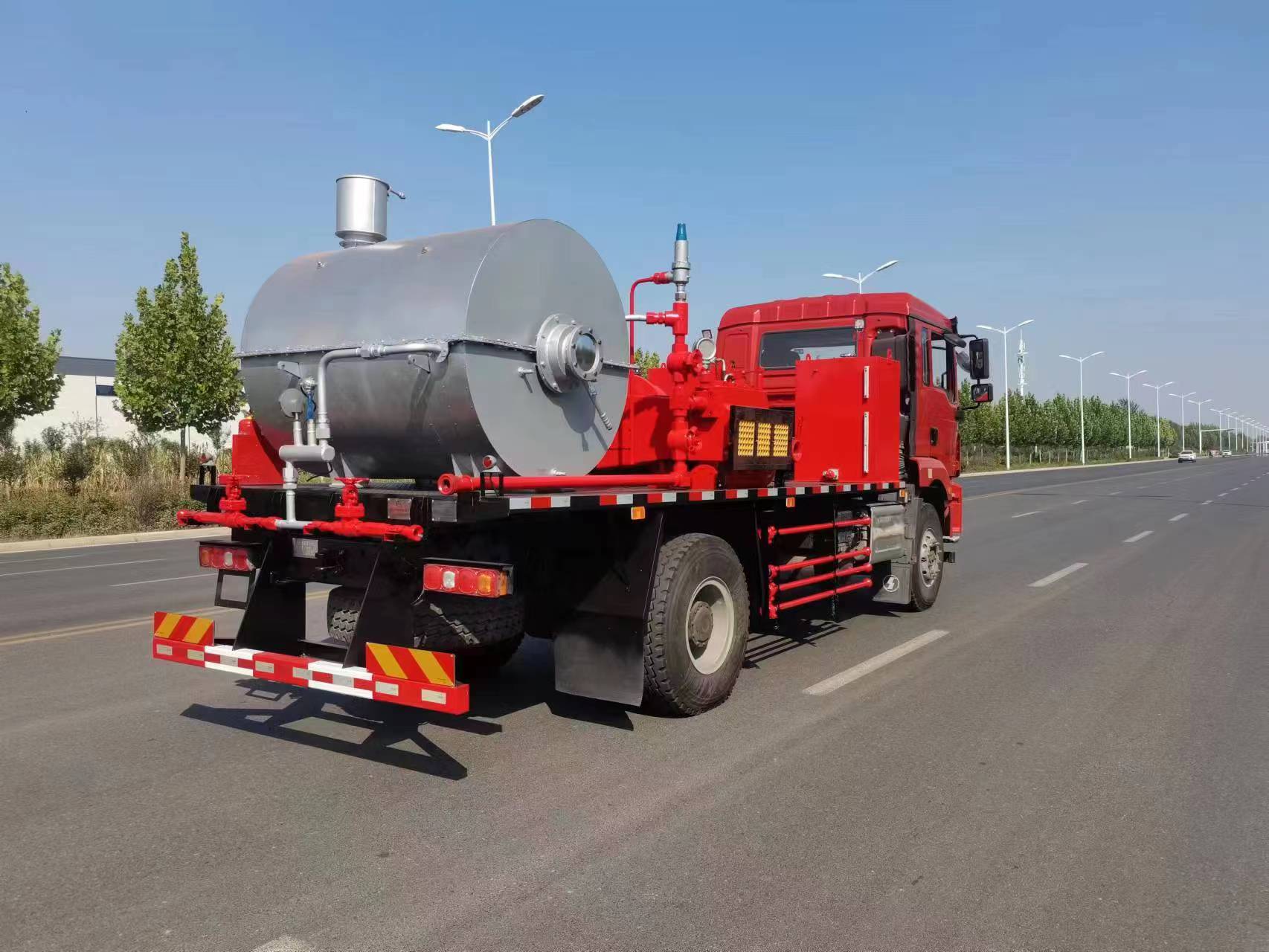 Paraffin removal truck rear view — fluid tank and piping manifold