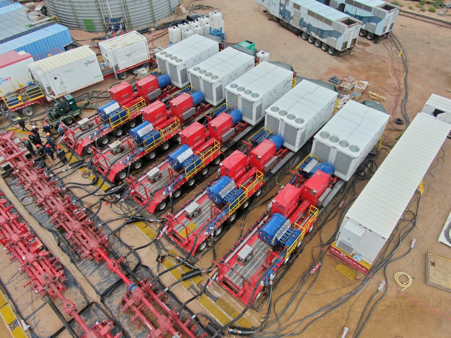 High-pressure pumping equipment arranged at an oilfield site