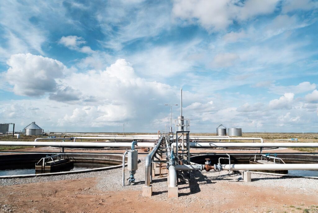 Modular produced water treatment system for remote oilfield pads