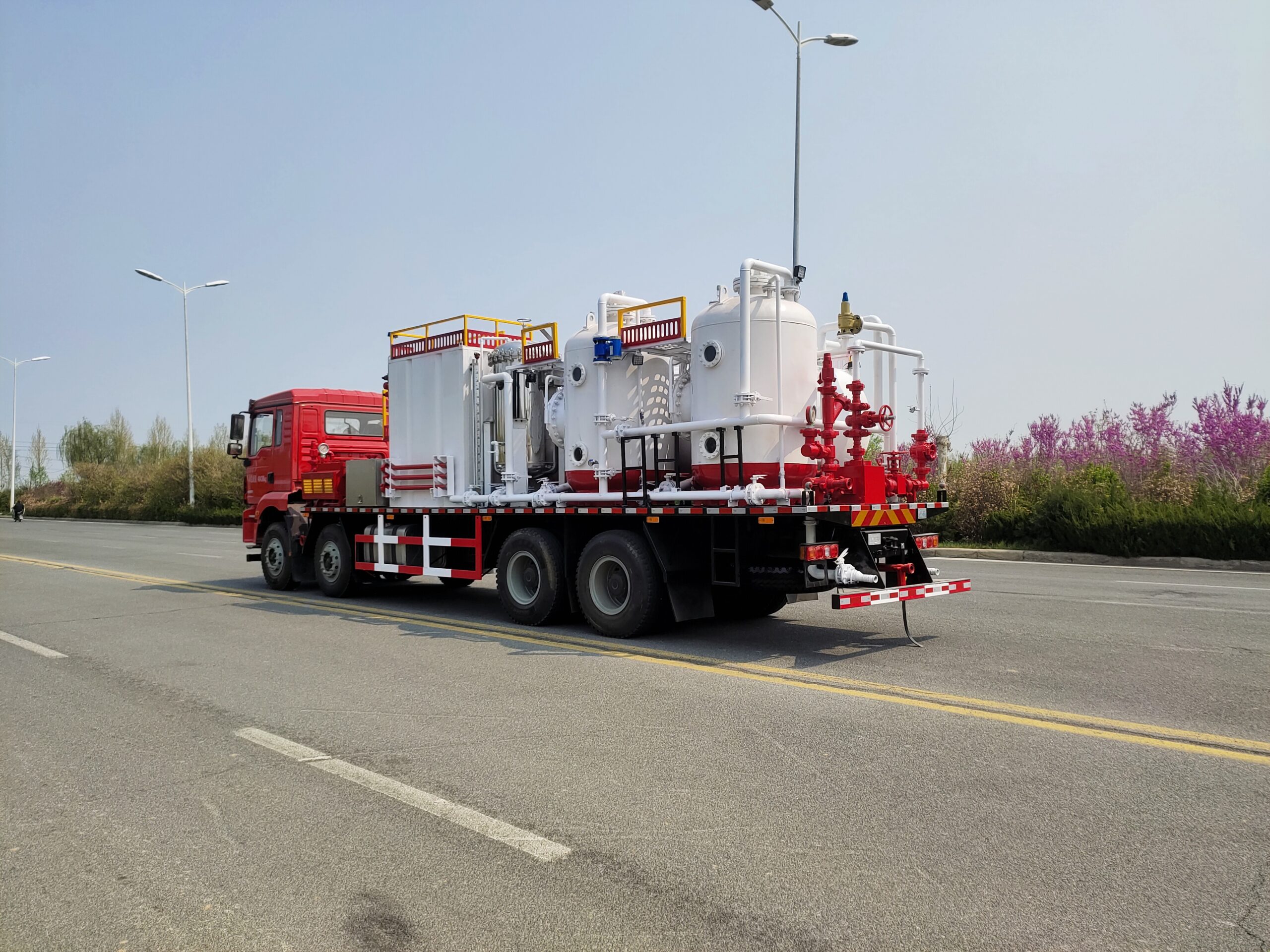 Sand flushing truck rear left angle — full system overview