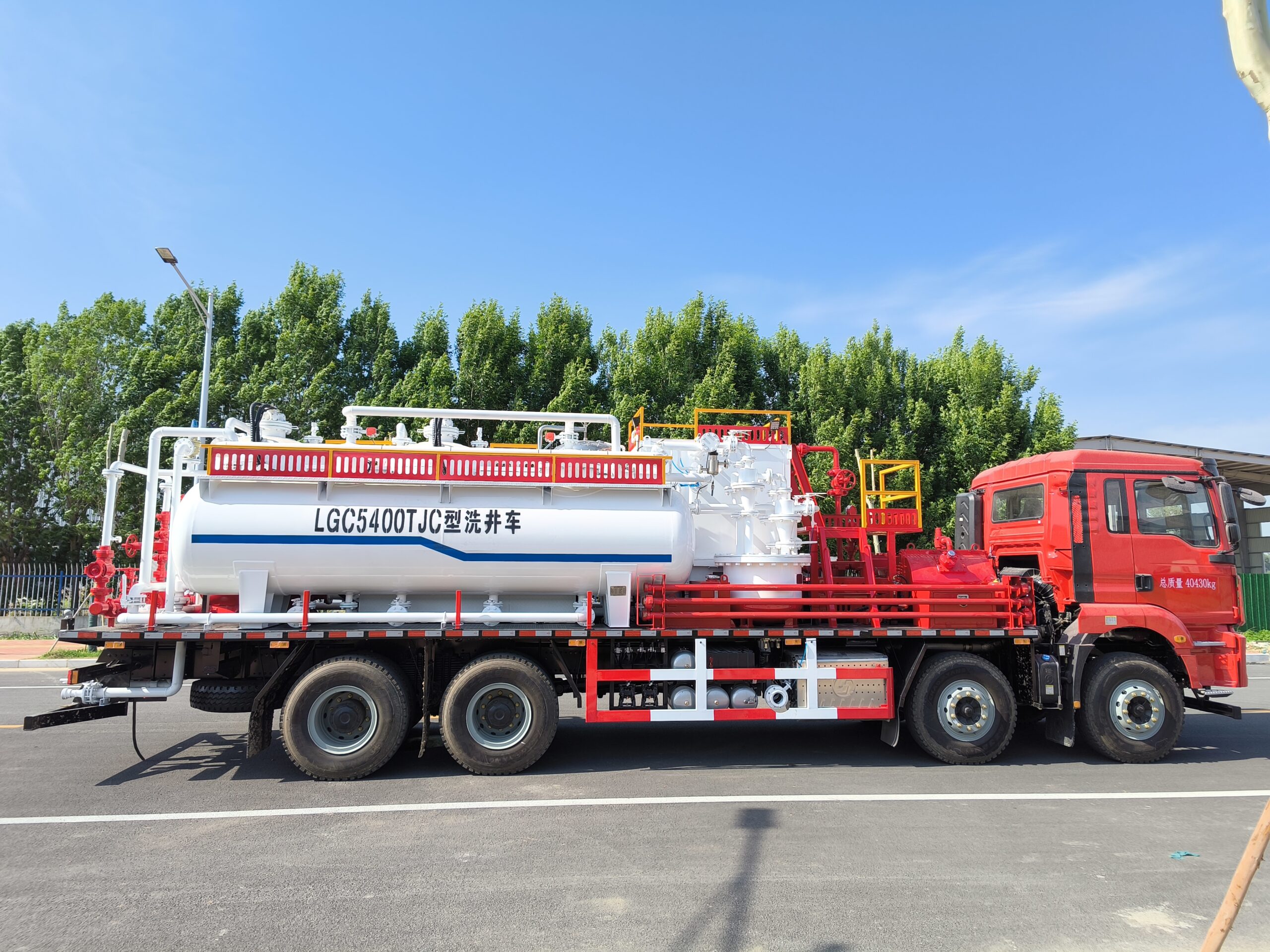 Oilfield sand flushing equipment close-up — pump and drive system detail